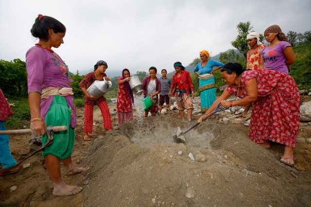 JP RWEE participants assist with the construction of an irrigation channel.