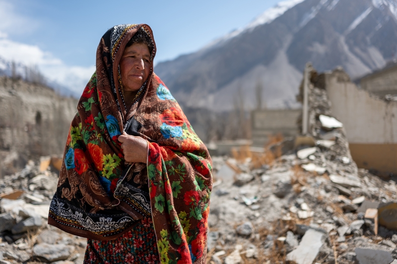 A villager walks among the ruins of her home in the town of Hassanabad in the Hunza Valley. Hassanabad was hit by floodwaters after a glacial lake burst in May 2022, destroying several homes. Photo by Todd Brown/ UNEP