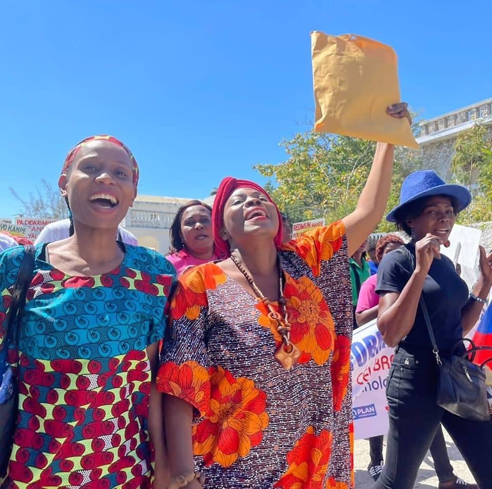 Jesula out in the field on another awareness raising campaign; this time marching with women 