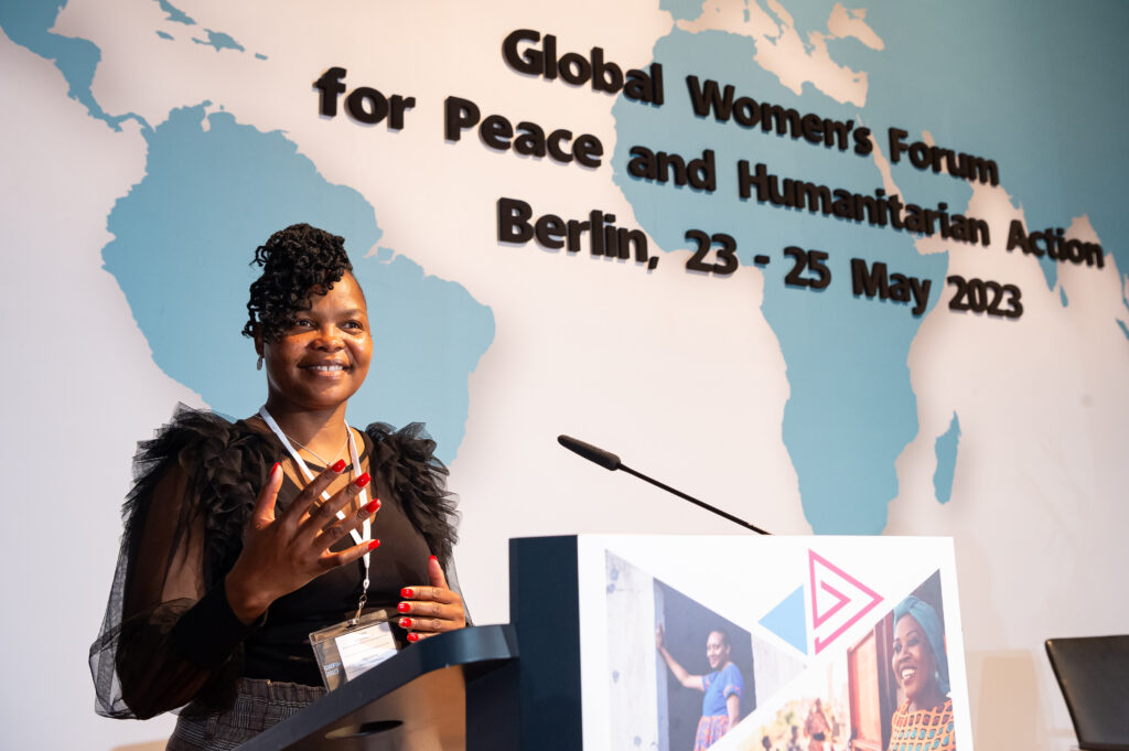 Vimbai on stage at the Global Women’s Forum for Peace and Humanitarian action 