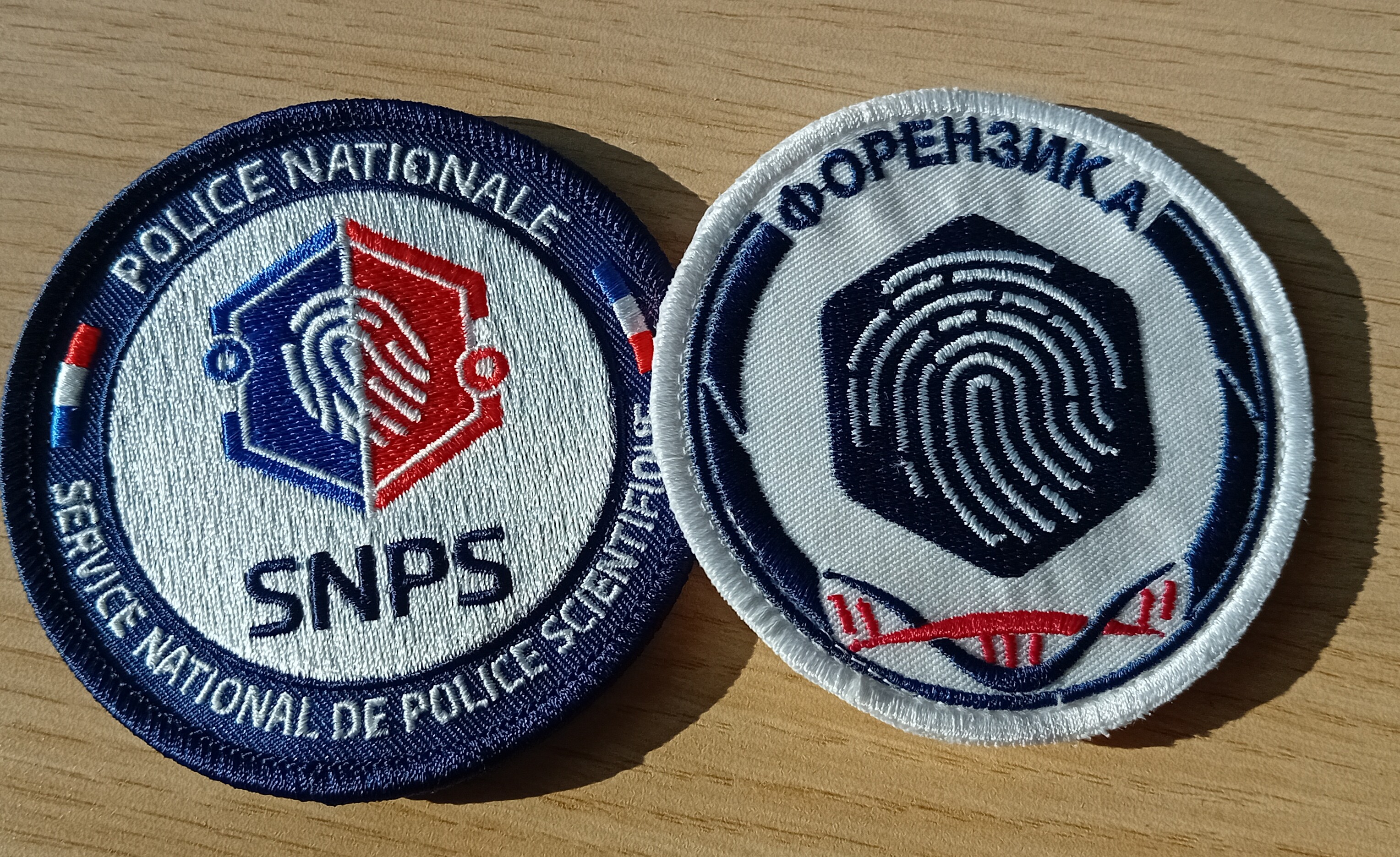N Balkans SALW two badges for forensic units, one French the other Northern Macedonian