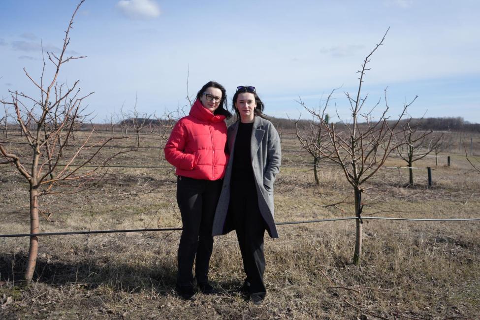 Natalia (left) and Halyna (right) in the apple orchard