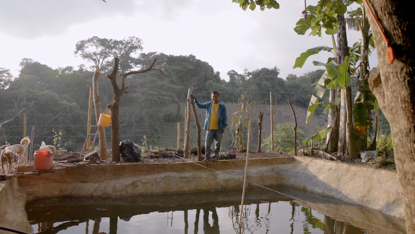 Ivan Azucena stands next to his water catchment pond on his farm in El Salvador. Across Central America, millions of farmers like him are threatened by alternating droughts and floods. Photo: UNEP/Samuel Díaz Fernández