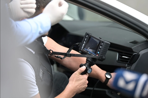 Kosovo Police officer performs a vehicle search during a training provided by UNDP