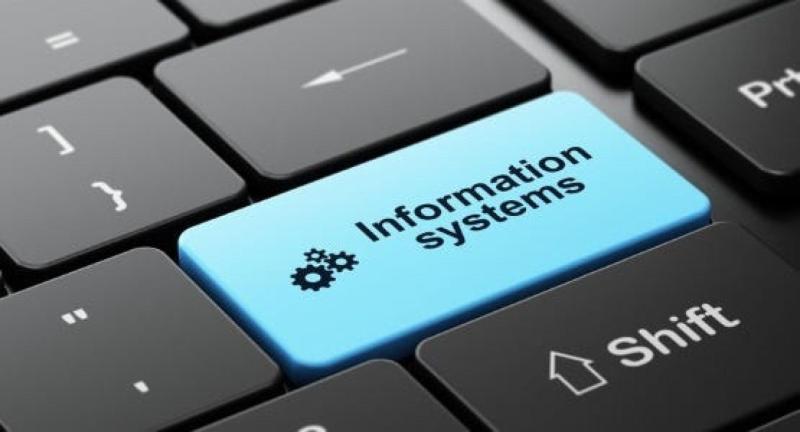 close up of a computer keyboard with a blue button reading Information Systems